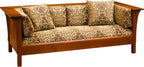 Wooden sofa with patterned cushions on a white background