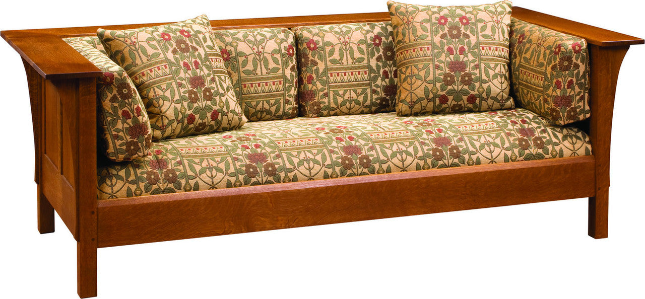 Wooden sofa with patterned cushions on a white background
