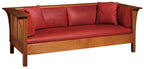 Wooden sofa with red leather cushions on a white background