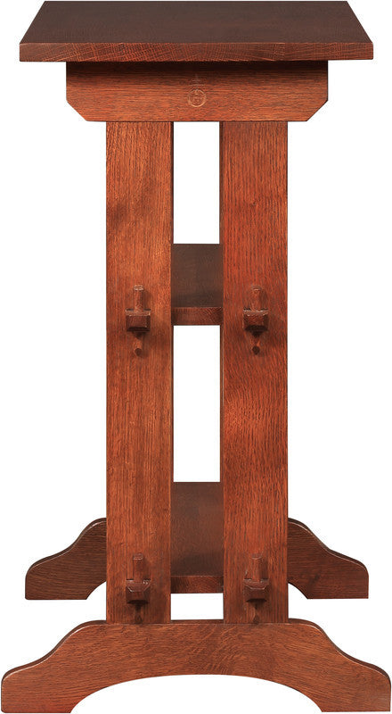 Wooden pedestal table with a dark brown finish on a white background