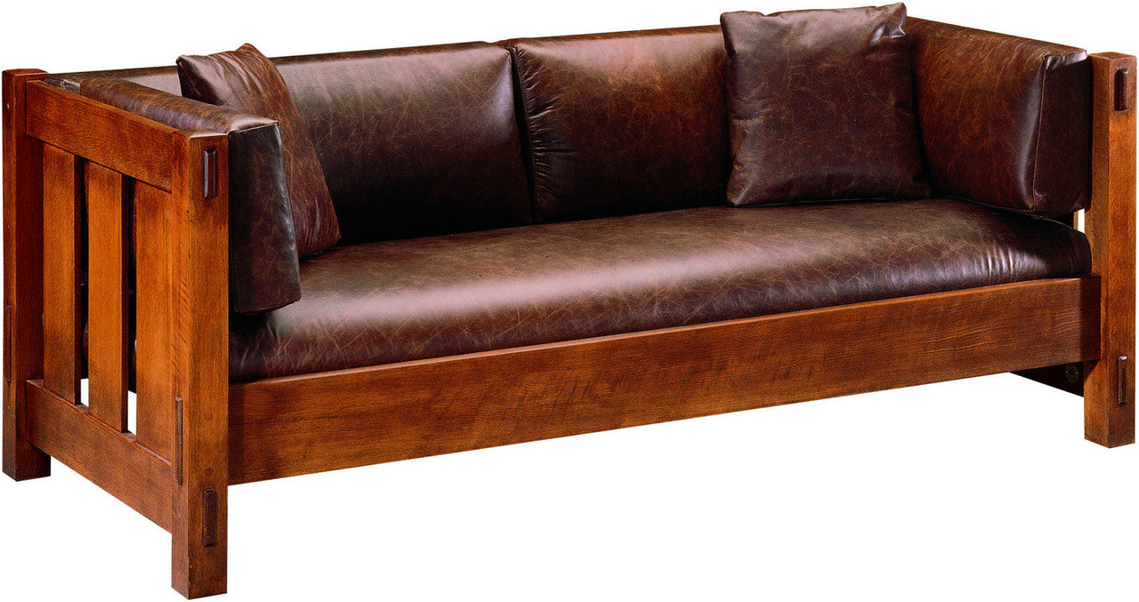 Brown leather sofa with wooden frame on a white background