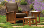 Wooden chair with brown cushions and ottoman in a garden setting