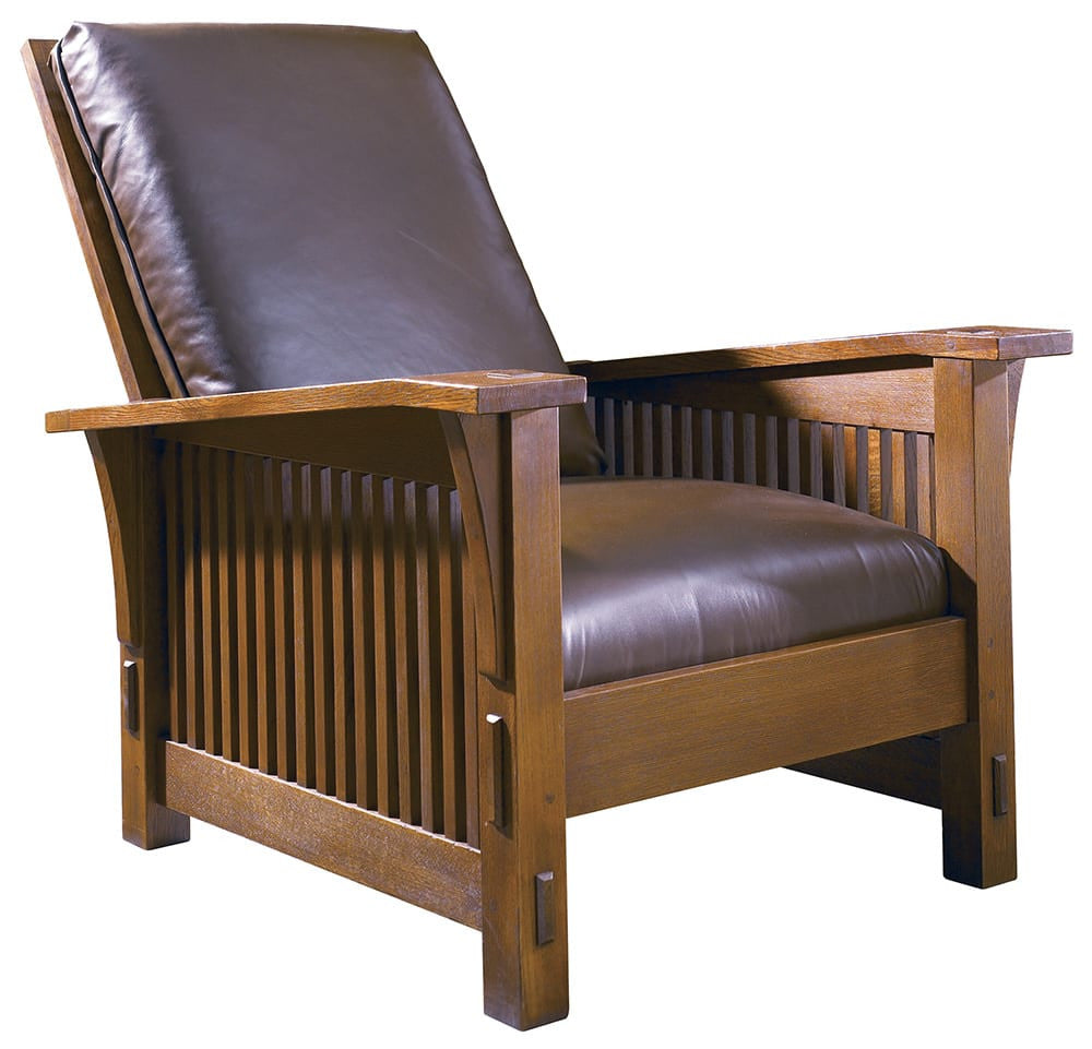 Wooden armchair with brown leather seat and backrest on a white background
