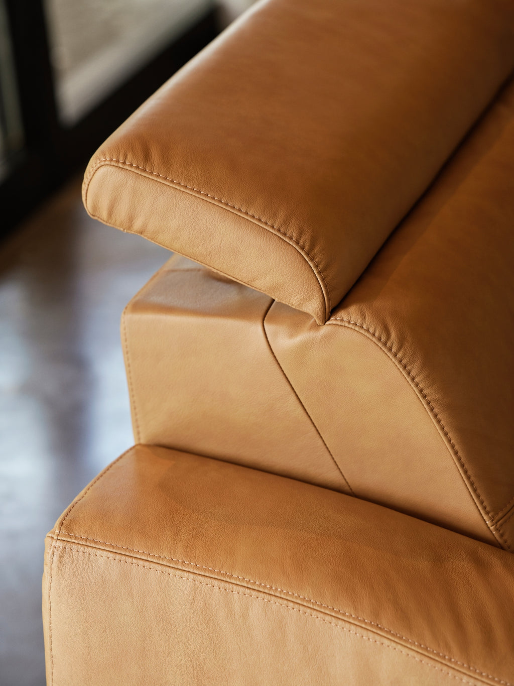 Close-up of the Stressless Anna adjustable headrest in Paloma Taupe leather