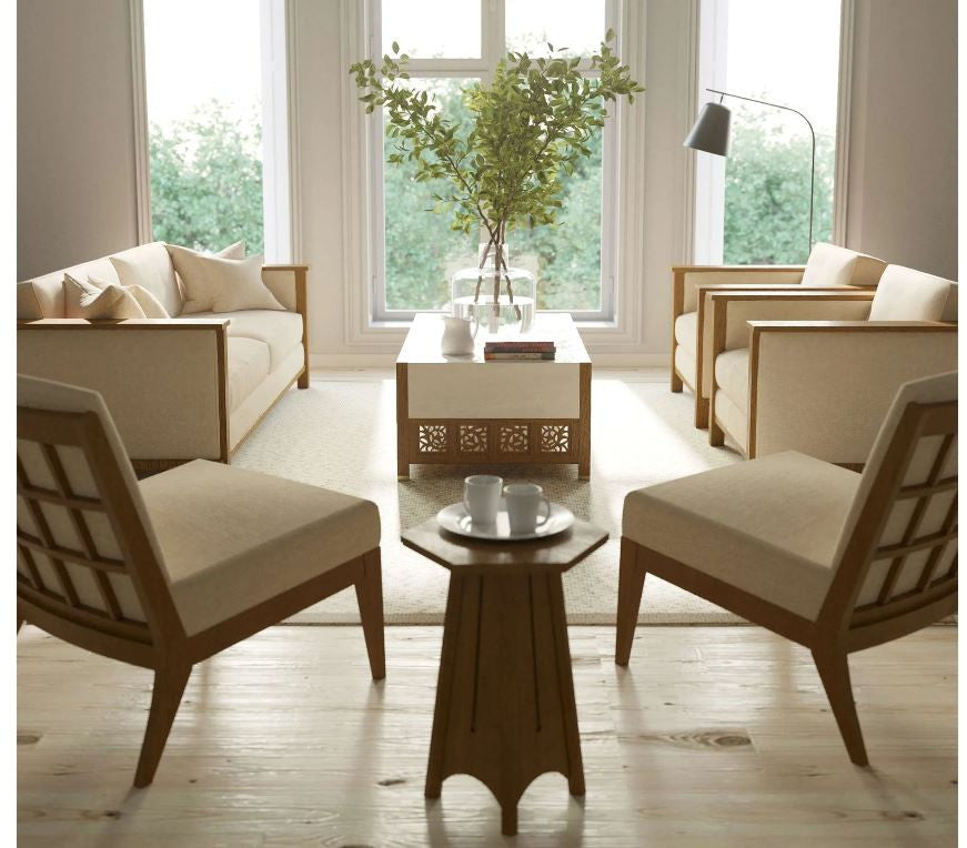 Modern living room with beige sofa, chairs, and coffee table near large windows.