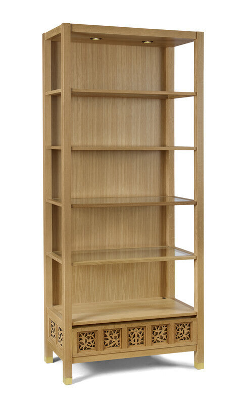 Wooden bookshelf with decorative patterns on a white background