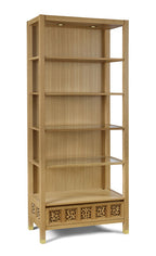 Wooden bookshelf with decorative patterns on a white background
