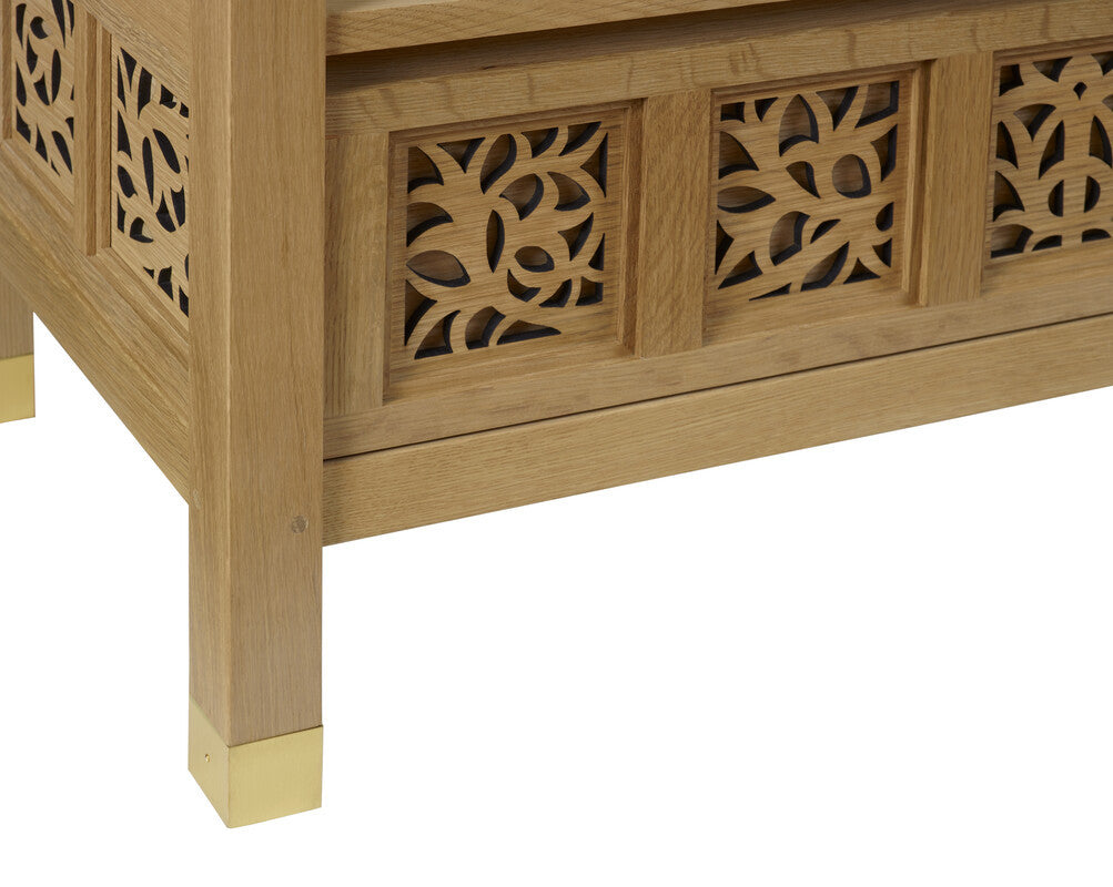 Wooden cabinet with decorative carvings on a white background