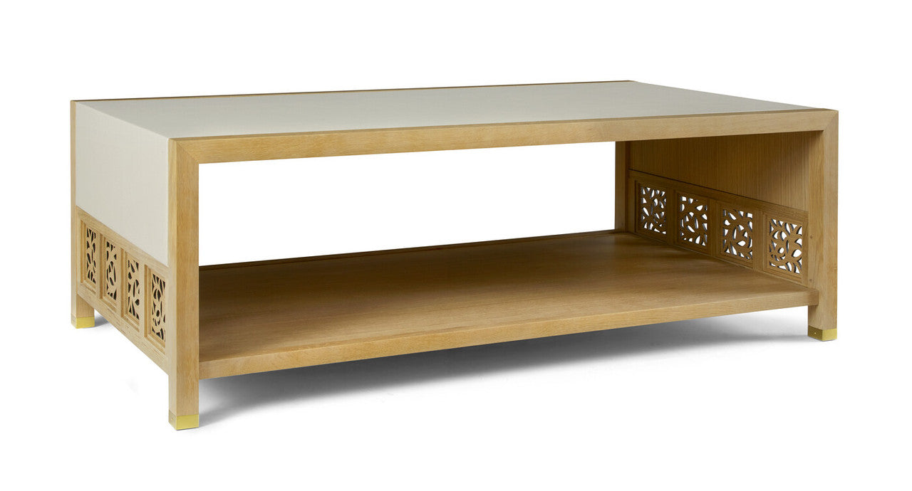 Coffee table with decorative cut-out sides on a white background
