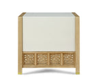 Wooden side table with decorative carvings on a white background