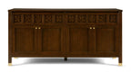 Wooden sideboard with decorative carvings on a white background