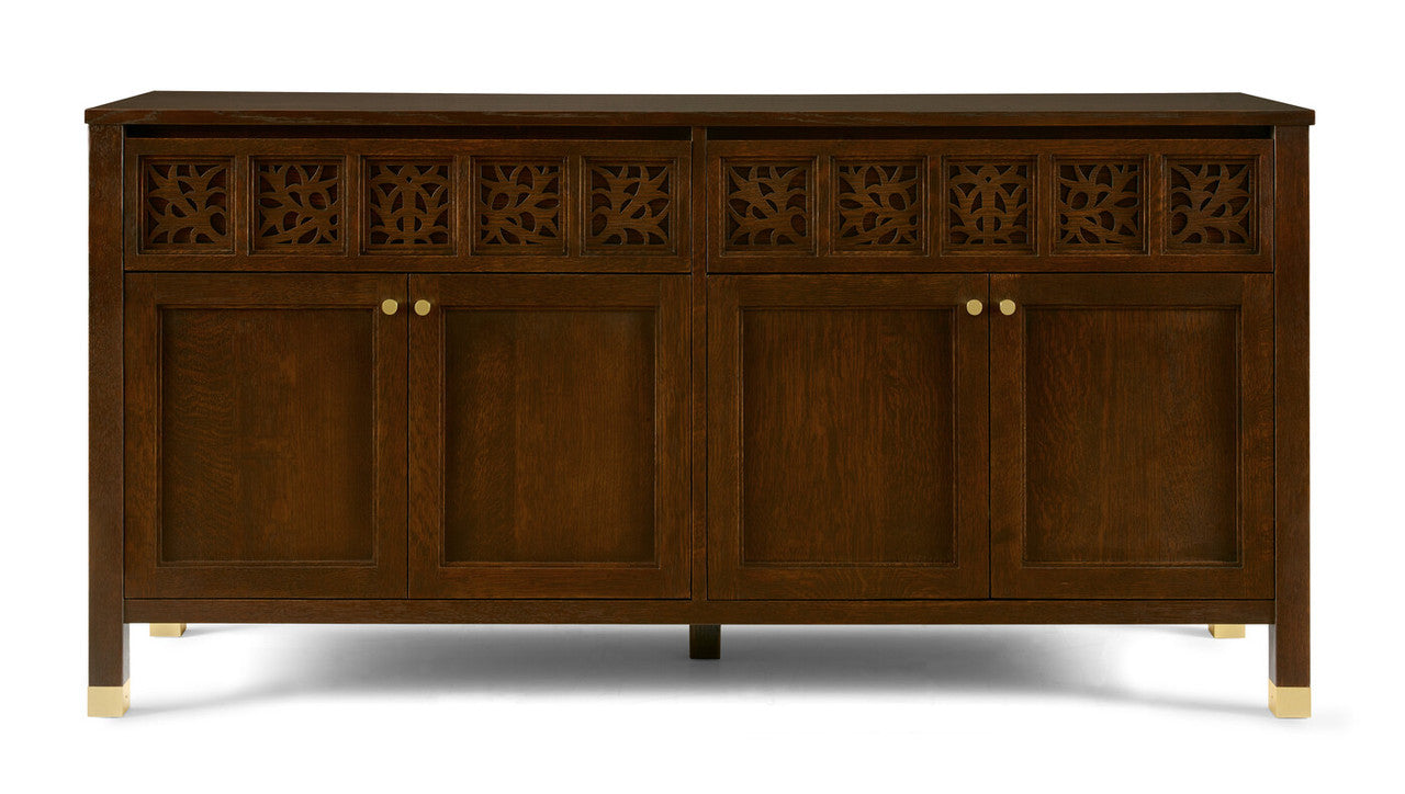 Wooden sideboard with decorative carvings on a white background