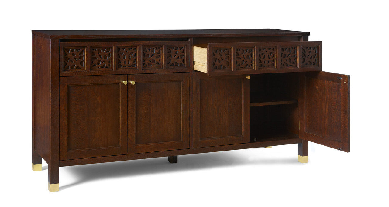 Wooden sideboard with decorative carvings on a white background