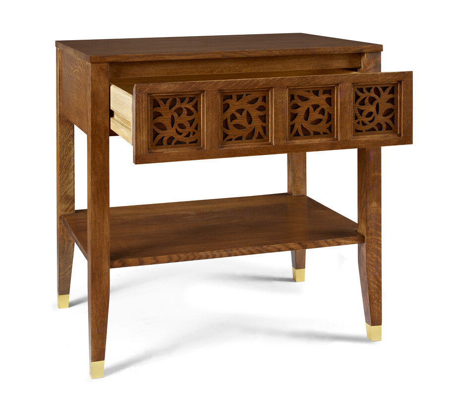 Wooden side table with decorative carvings on a white background