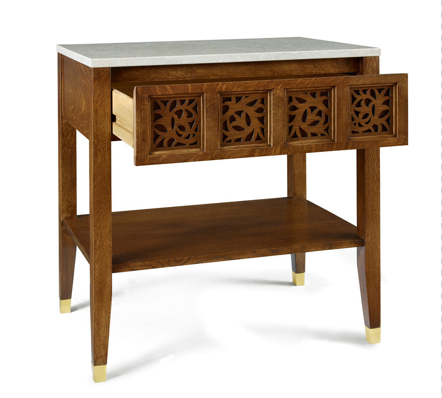 Wooden side table with marble top and decorative carvings on a white background