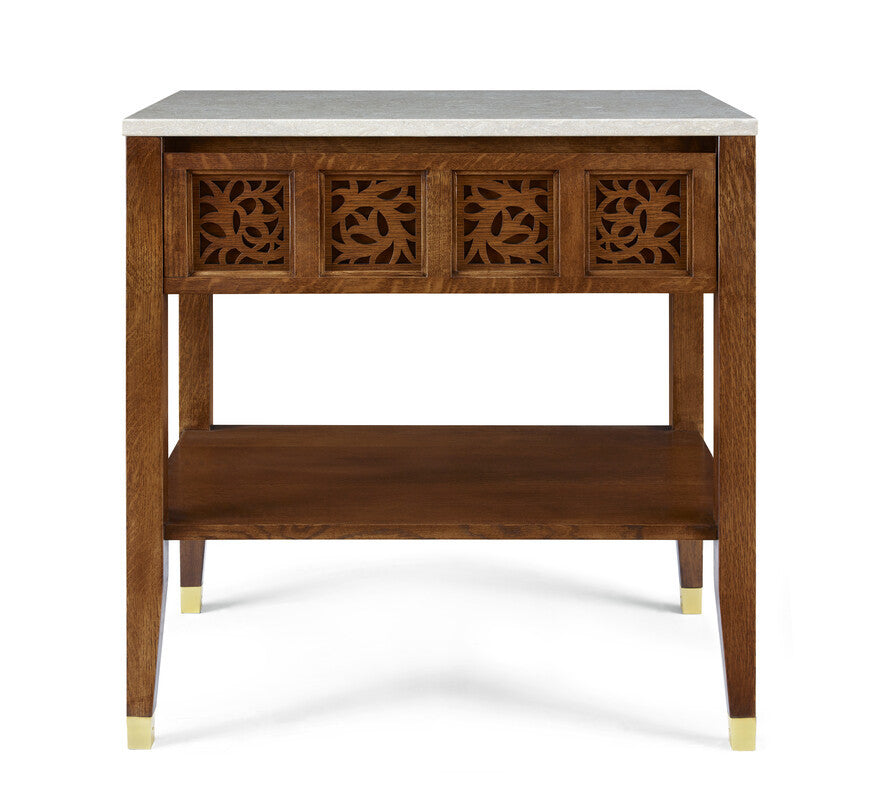 Wooden side table with decorative carvings and a white marble top on a white background