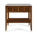 Wooden side table with decorative carvings and a white marble top on a white background