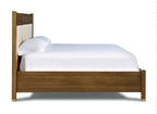 Wooden bed frame with white bedding on a white background