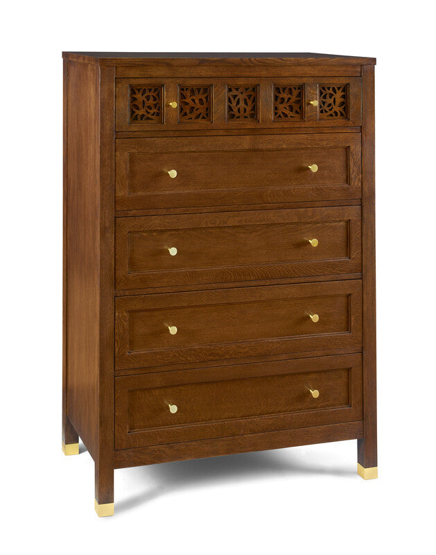 Wooden dresser with decorative carvings on a white background
