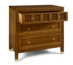 Wooden dresser with decorative carvings on a white background
