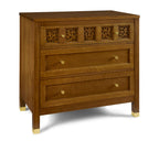 Wooden dresser with decorative carvings on a white background
