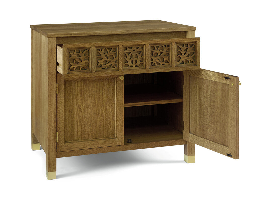 Wooden sideboard with open doors on a white background