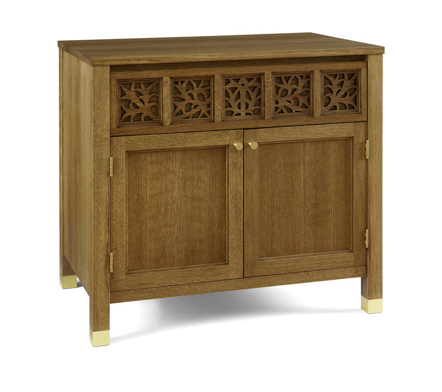 Wooden sideboard with decorative carvings on a white background