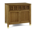 Wooden sideboard with decorative carvings on a white background