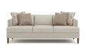 Beige sofa with patterned cushions on a white background