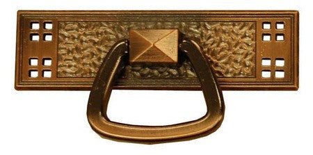 Bronze door knocker with decorative background