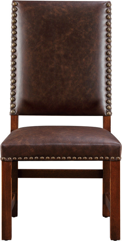 Brown leather chair with nailhead trim on a white background