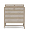 Beige dresser with glass-fronted drawers on a white background