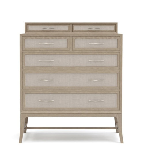 Beige dresser with glass-fronted drawers on a white background