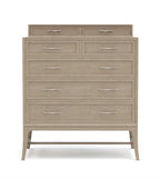 Beige dresser with multiple drawers on a white background