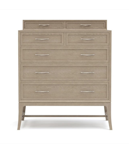 Beige dresser with multiple drawers on a white background