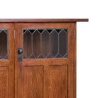Wooden door with glass panels on a white background.