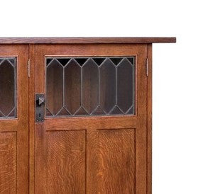 Wooden door with glass panels on a white background.