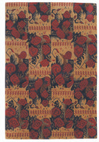 Patterned fabric with red and blue floral design on a beige background