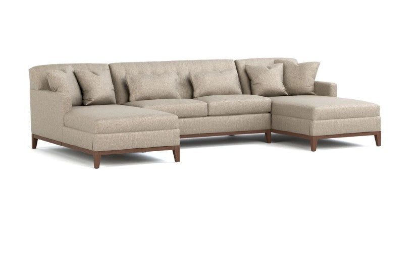 A light beige upholstered sectional sofa with a left-facing chaise and a right-facing chaise, featuring tufted back cushions and dark brown wooden legs, shown on a solid white background.