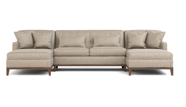 A modern three-seater sectional sofa with a left-facing chaise and a right-facing chaise, upholstered in a textured light beige fabric with dark brown wooden legs, shown against a plain white background.
