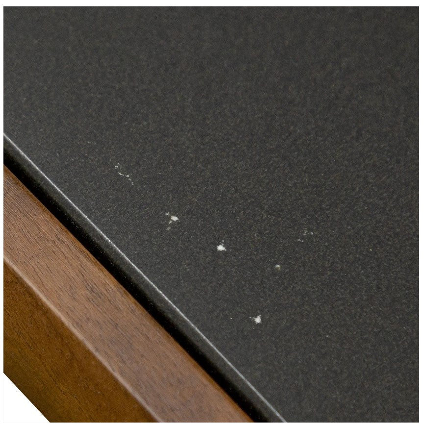 Image of stone top with flecks of grey against black. 