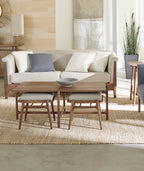 Walnut Grove Low Stool by Stickley in front of couch. 