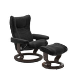Black recliner chair with ottoman on a white background