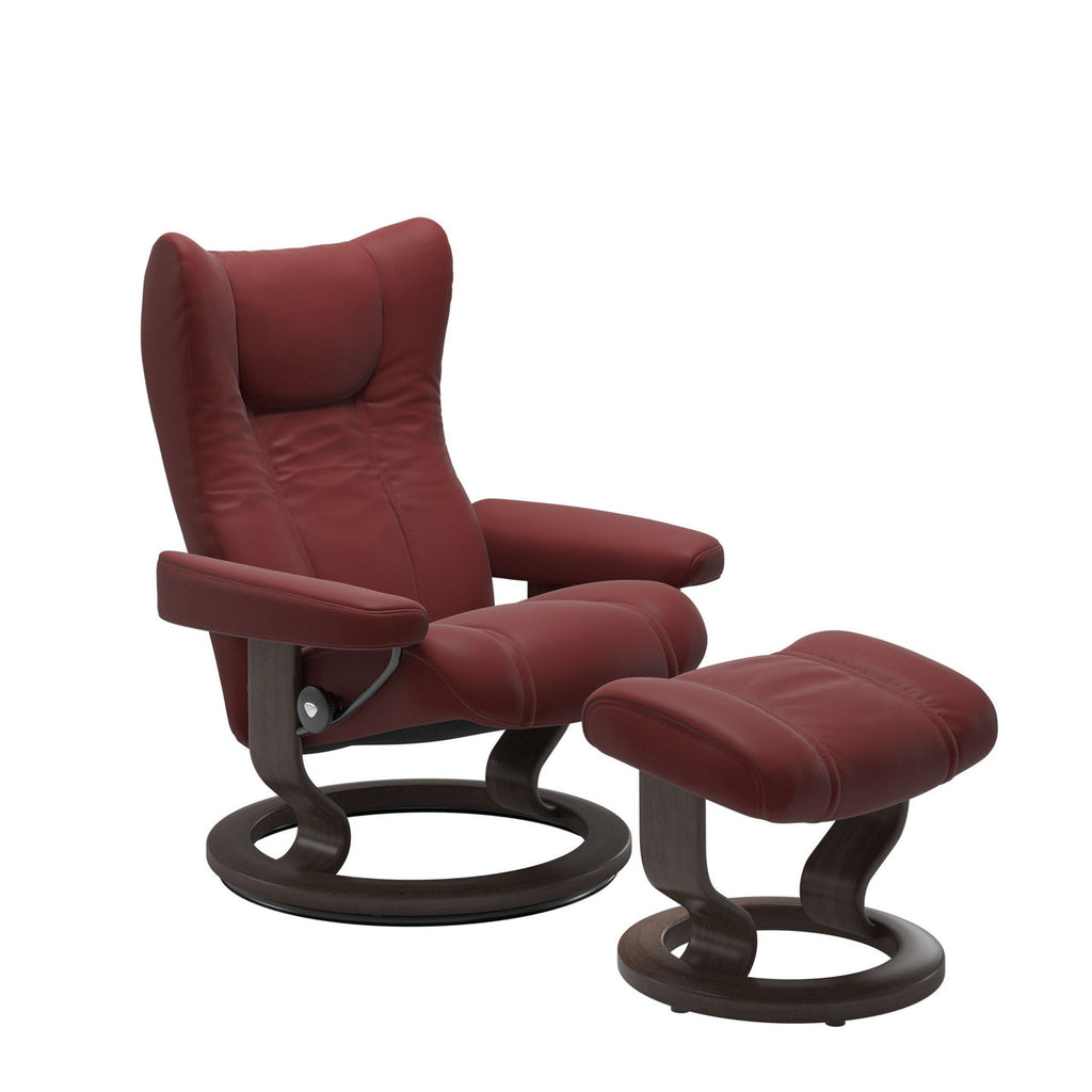 Red leather recliner chair with ottoman on a white background