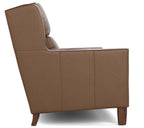 A brown upholstered armchair shown from a side angle against a plain white background.