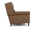 Brown leather armchair on a white background