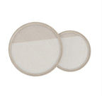 Two round, beige-colored filters on a white background