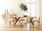 Dining room with wooden table and chairs in a bright room