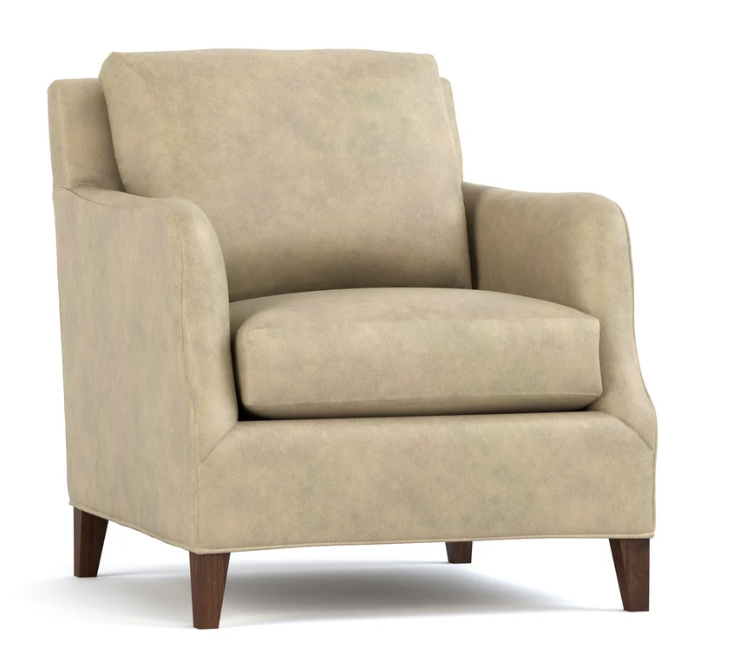 A classic armchair upholstered in a textured beige fabric, featuring dark brown wooden legs, shown against a plain white background.