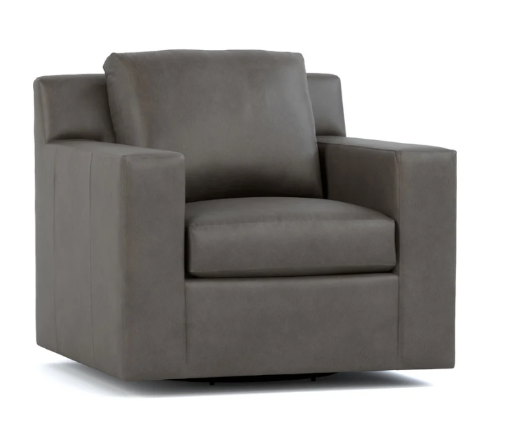 A dark gray upholstered armchair with a square backrest and wide armrests, shown on a plain white background.